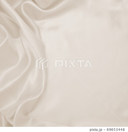 Smooth elegant golden silk or satin luxury cloth texture as wedding background. Luxurious background design. In Sepia toned. Retro style Smooth elegant golden silk or satin luxury cloth texture as wedding background. Luxurious background design. In Sepia toned. Retro style 69653448