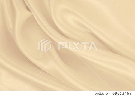 Smooth elegant golden silk or satin luxury cloth texture as wedding background. Luxurious background design. In Sepia toned. Retro style Smooth elegant golden silk or satin luxury cloth texture as wedding background. Luxurious background design. In Sepia toned. Retro style 69653465