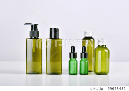 Group of green cosmetic bottle container on white background, Blank label for skincare Group of green cosmetic bottle container on white background, Blank label for skincare 69653482