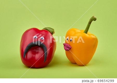 Couple of funny bell peppers having conversation. Couple of funny bell peppers having conversation. 69654299
