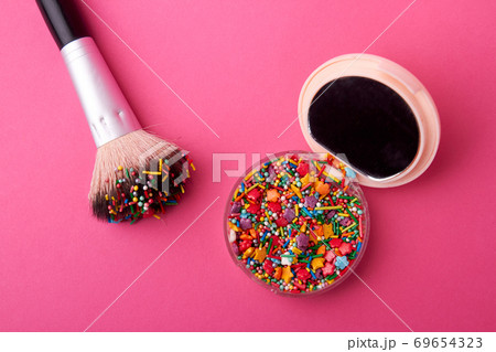 Cosmetic powder case with sweet sprinkles. Cosmetic powder case with sweet sprinkles. 69654323