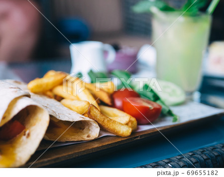 Tasty lunch on wrap potatoes and lemonade 69655182