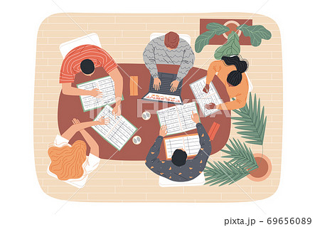 Group of students at the table are studying. Top view. 69656089