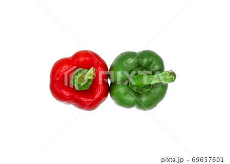 Close up top view of red and green peppers isolated to white background with selective focus 69657601
