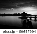 A love couple enjoying sunset at Peirce Reservoir Singapore. 69657994