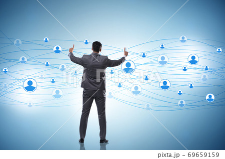 Man pressing virtual button on social network concept 69659159