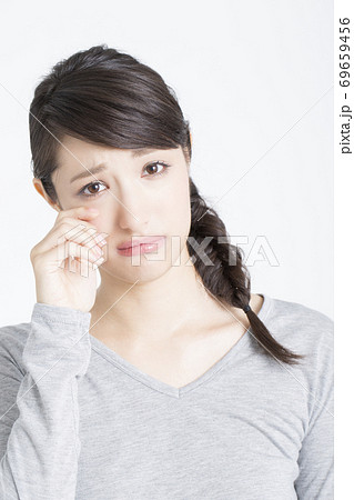 悲しい顔の女性の写真素材