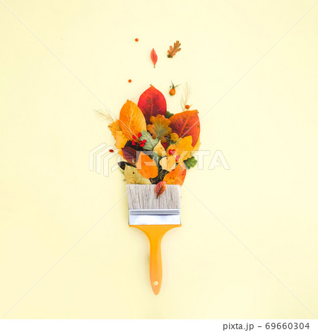 Brush paint with colorful autumn leaves, creative concept of autumn, leaf fall Brush paint with colorful autumn leaves, creative concept of autumn, leaf fall 69660304