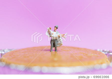 Miniature people wedding , bride and groom couple on pink background , Miniature people wedding , bride and groom couple on pink background , 69661066