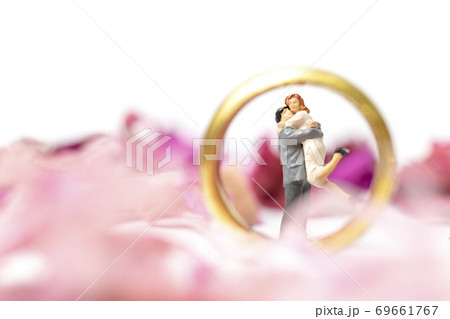 Couple hug in The pink garden with a wedding ring 69661767