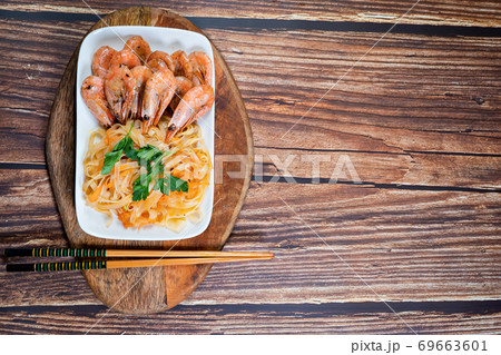 Udon noodles and fried cocktail prawns. copy space Udon noodles and fried cocktail prawns. copy space 69663601