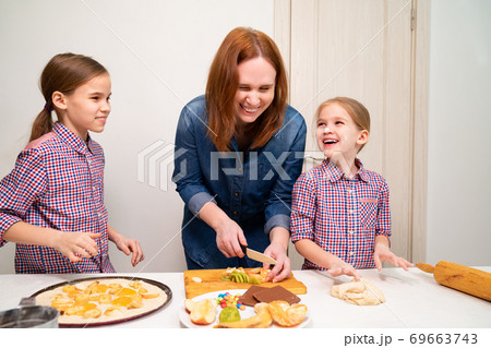 kid hands knead heart yeast dough for pizza or pie 69663743