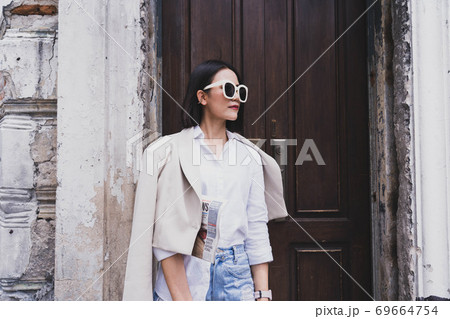 Fashionable woman with copy space stock photo.Cropped shot of a beautiful young female walking through the city 69664754