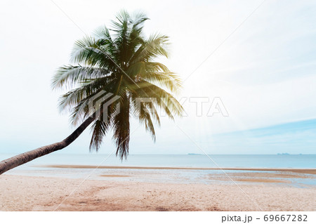 Tropical nature clean beach and white sand in summer with sun light blue sky and bokeh background. 69667282