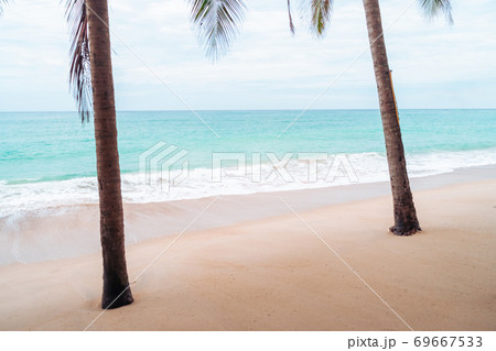 Tropical nature clean beach and white sand in summer with sun light blue sky and bokeh background. Tropical nature clean beach and white sand in summer with sun light blue sky and bokeh background. 69667533