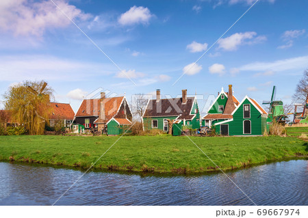 Amsterdam Netherlands, Dutch Windmill and traditional house at Zaanse Schans Village Amsterdam Netherlands, Dutch Windmill and traditional house at Zaanse Schans Village 69667974