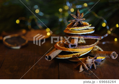 Christmas tree made of dried oranges, cinnamon sticks and anise star seeds 69668264