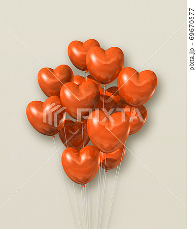 Orange heart shape air balloons group on a beige background 69670577