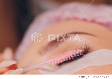 Woman Eye with Long Eyelashes. Eyelash Extension. Woman Eye with Long Eyelashes. Eyelash Extension. 69672517