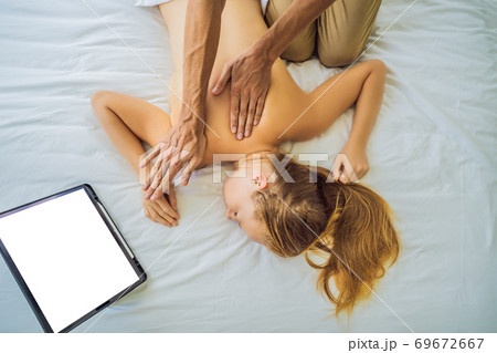 Massage by training online video. Online massage training. Health Wellness Massage Online Training Concept Massage by training online video. Online massage training. Health Wellness Massage Online Training Concept 69672667