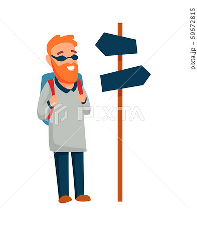 Tourist. Concept of an active lifestyle, tourism. Man stands in front of the direction indicators is looking ahead and smile. Route Tourist. Concept of an active lifestyle, tourism. Man stands in front of the direction indicators is looking ahead and smile. Route 69672815