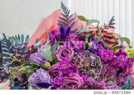Wedding bouquet of different flowers from light background, close up 69672886