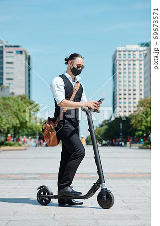 Entrepreneur checking smartphone 69673571