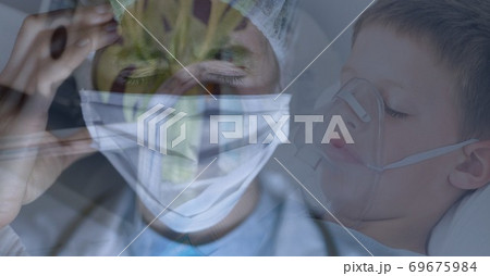 Digital illustration of a doctor wearing a face mask over a child patient lying in a bed Digital illustration of a doctor wearing a face mask over a child patient lying in a bed 69675984