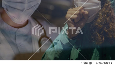 Digital illustration of a woman with a mask coughing over a doctor with a mask 69676043
