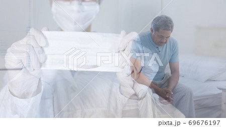Digital illustration of a doctor wearing a face mask holding a mask over a senior male Digital illustration of a doctor wearing a face mask holding a mask over a senior male 69676197
