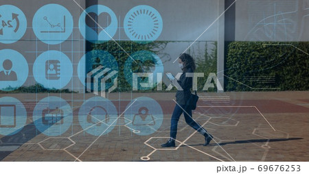 Digital illustration of a woman with a mask using a smartphone over medical icons Digital illustration of a woman with a mask using a smartphone over medical icons 69676253