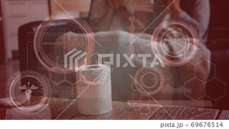 Digital illustration of two people sitting on a couch with a toilet paper roll standing in front of Digital illustration of two people sitting on a couch with a toilet paper roll standing in front of 69676514