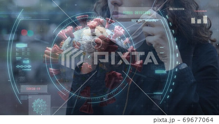 Scope scanning Covid-19 cells against woman wearing face mask 69677064