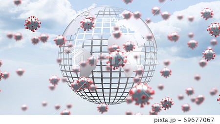 Covid-19 cells and globe against sky in background 69677067