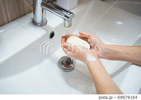 washing of female hands soap and water washing of female hands soap and water 69679164
