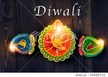 overhead clay lit light a fire already on Diya or oil lamp overhead clay lit light a fire already on Diya or oil lamp 69680530