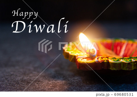 clay lit light a fire already on Diya or oil lamp 69680531