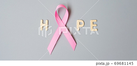 October Breast Cancer Awareness month, Pink Ribbon with HOPE text on grey background for supporting people living and illness. International Women, Mother and World cancer day concept 69681145