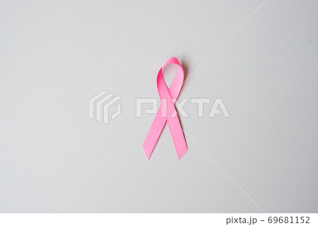 October Breast Cancer Awareness month, Pink Ribbon on grey background for supporting people living and illness. International Women, Mother and World cancer day concept 69681152