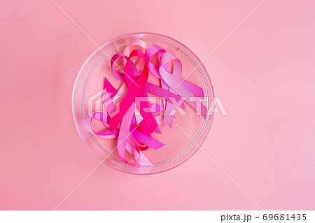 October Breast Cancer Awareness month, Pink Ribbon on pink background for supporting people living and illness. International Women, Mother and World cancer day concept 69681435