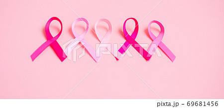 October Breast Cancer Awareness month, Pink Ribbon on pink background for supporting people living and illness. International Women, Mother and World cancer day concept October Breast Cancer Awareness month, Pink Ribbon on pink background for supporting people living and illness. International Women, Mother and World cancer day concept 69681456