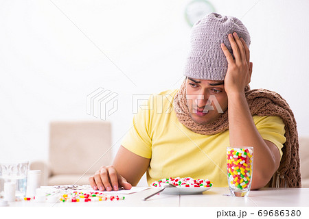 Young man suffering at home Young man suffering at home 69686380