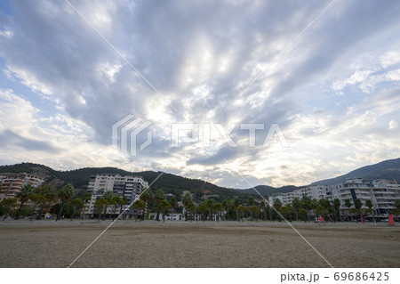 The beautiful city of Vlore, with its gorgeous mountains and cloudy blue sky. 69686425