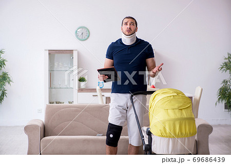 Young injured man looking after newborn in unrequited love 69686439