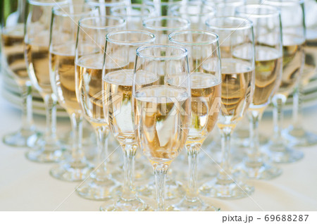 Glasses with champagne on the table. Catering. Buffet Glasses with champagne on the table. Catering. Buffet 69688287