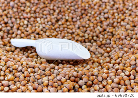 hazelnuts for sale at a farmers market, selective focus. hazelnuts for sale at a farmers market, selective focus. 69690720