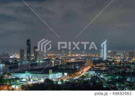 Rama 9 bridge and Kasikorn Building, with skyscraper high rise buildings in urban city, Downtown Bangkok skyline, Thailand at night. Rama 9 bridge and Kasikorn Building, with skyscraper high rise buildings in urban city, Downtown Bangkok skyline, Thailand at night. 69692062