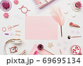 Pink blank paper on fashion feminine desk top view 69695134