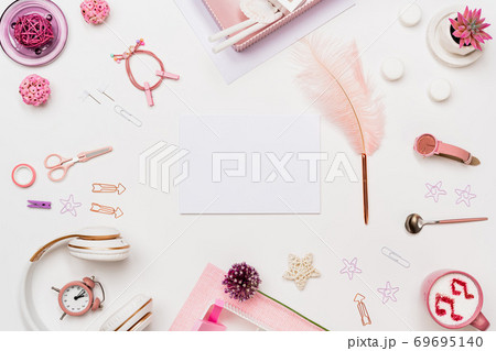 Woman home office desk with blank paper mockup Woman home office desk with blank paper mockup 69695140