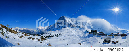 Panoramic view from Kleine Scheidegg station, along the railway from Interlaken to Jungfraujoch In daylight at Switzerland Panoramic view from Kleine Scheidegg station, along the railway from Interlaken to Jungfraujoch In daylight at Switzerland 69696294